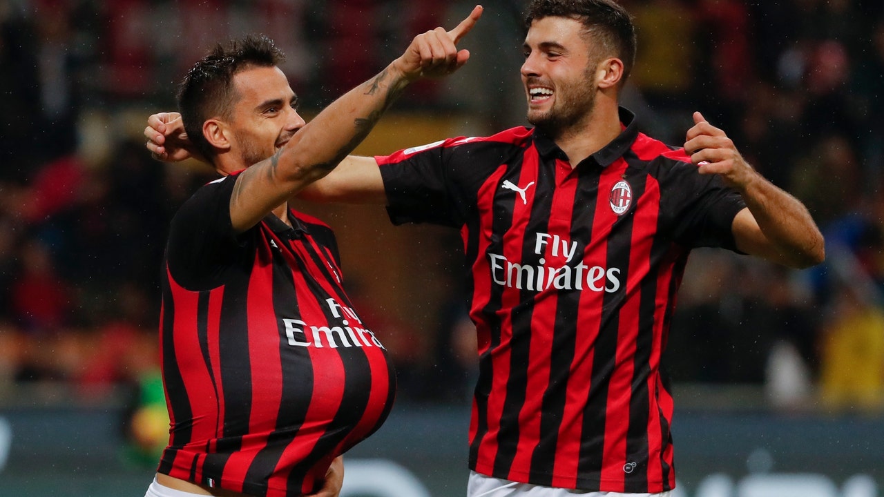 AC Milan moves into Champions League places with 2-1 win